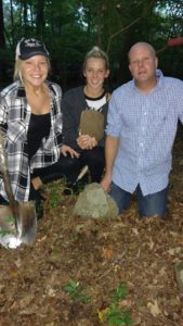 Danielle Dionne (left), Kassie Sandra, and Jason Dionne. Kassie holding a recovered foot stone